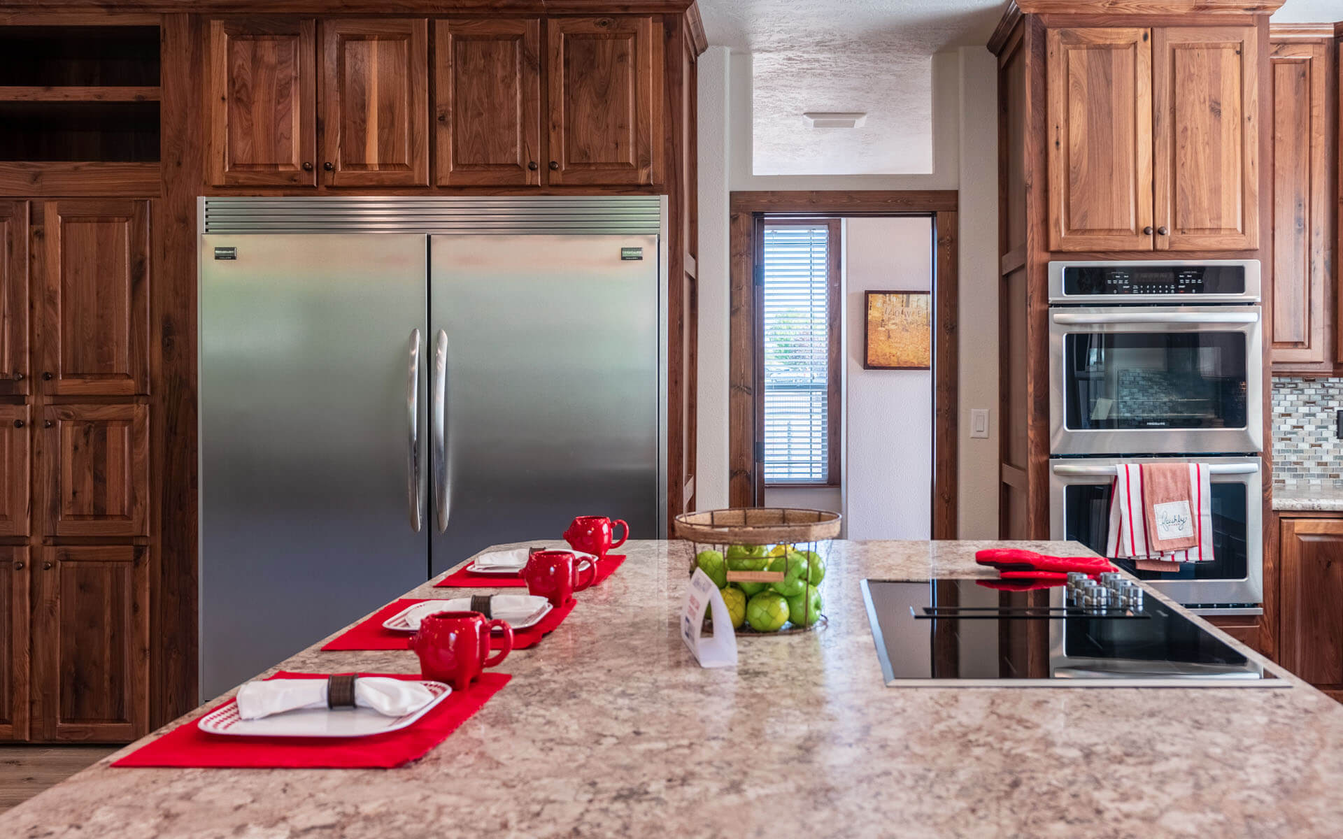 Interior photo of a manufactured home kitchen island and appliances